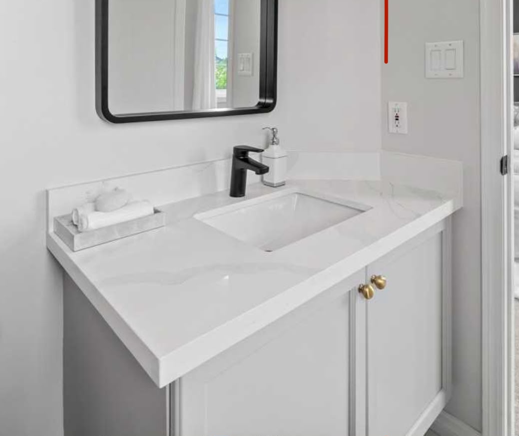 White vanity, black fixtures