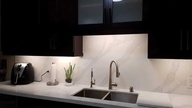 Veined quartz and black cabinetry